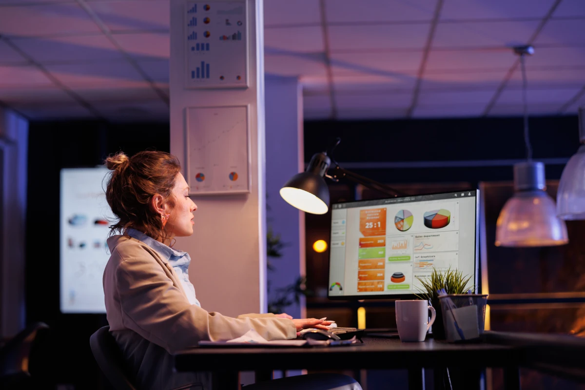 Marketing analyst analyzing campaign dashboards for growth scaling